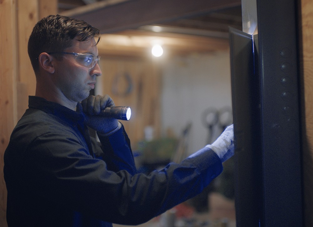 Constellation worker holding flashlight